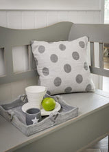 Grey/ white spot cushions.