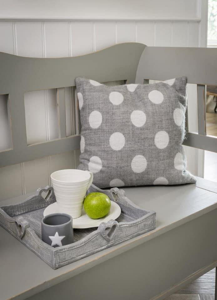 Grey/ white spot cushions.