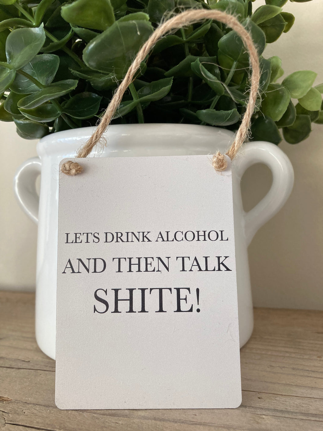 ‘let’s drink alcohol and … ‘ small hanging sign